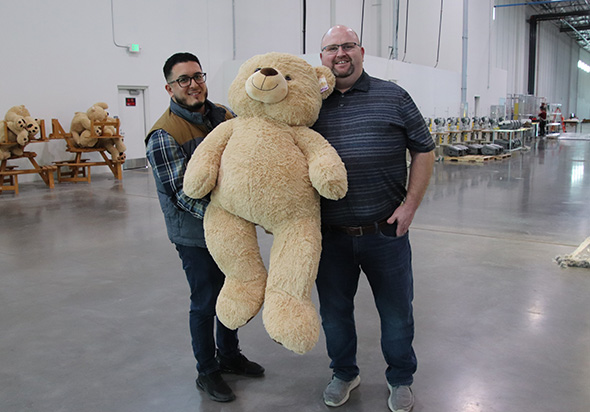 Fairfield and City of Goodyear team members holding stuffed bear