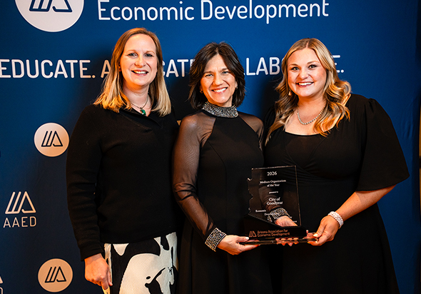 Three Goodyear Economic Development employees. Wendy Bridges (middle) holding the EDDE Award for Economic Development Organization of the Year (medium) received at the 2026 AAED Spring Conference. 